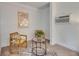 Charming sitting area features comfortable chairs, a stylish table, and modern artwork at 2920 N 11Th St, Tampa, FL 33605