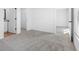 Comfortable bedroom with neutral carpet, doors to other areas, and a closet at 29587 Fedora Cir, Brooksville, FL 34602