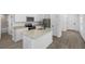 Modern kitchen with granite countertops, stainless appliances, and white cabinets with ample storage space at 29587 Fedora Cir, Brooksville, FL 34602