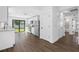 Modern kitchen with stainless steel appliances, white cabinets, and sliding doors to the backyard at 29629 Fedora Cir, Brooksville, FL 34602