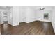 Inviting living room with neutral walls, wood floors, and a ceiling fan at 29629 Fedora Cir, Brooksville, FL 34602