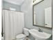 This bathroom features a sleek sink, toilet, and bathtub with shower and a crisp, clean look at 3025 W Grovewood Ct # B, Tampa, FL 33629