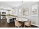 Eat-in kitchen featuring granite countertops, stainless appliances, and seating area with stylish lighting at 3025 W Grovewood Ct # B, Tampa, FL 33629