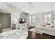 Open-concept living area with decorative lighting, staircase, hardwood flooring, and stylish furnishings at 3025 W Grovewood Ct # B, Tampa, FL 33629