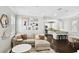 Cozy living room with stylish decor, comfortable sofa, and adjacent modern kitchen at 3025 W Grovewood Ct # B, Tampa, FL 33629