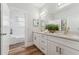 Bathroom with double vanity, modern fixtures, stone countertops, and bright lighting at 307 S Newport Ave, Tampa, FL 33606