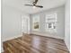 Bedroom with hardwood floors, bright lighting, two windows, and white trim at 307 S Newport Ave, Tampa, FL 33606