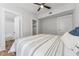 Cozy bedroom with an ensuite bathroom, walk-in closet, modern ceiling fan, and ample natural light at 307 S Newport Ave, Tampa, FL 33606