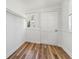 This closet features a wood-look floor, a window, and a closet rod at 307 S Newport Ave, Tampa, FL 33606