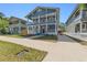 Charming two-story blue home with double porches, white trim and manicured front lawn at 307 S Newport Ave, Tampa, FL 33606