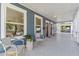 Inviting front porch with patterned tile, comfortable seating, and charming curb appeal at 307 S Newport Ave, Tampa, FL 33606