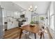 Well-lit kitchen with stainless appliances, white cabinetry, and seamlessly connected to the dining area at 307 S Newport Ave, Tampa, FL 33606