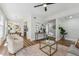 Open-concept living room with hardwood floors, contemporary decor, and seamless flow to dining area at 307 S Newport Ave, Tampa, FL 33606