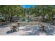Beautiful outdoor plaza with a central fountain, surrounded by shaded seating and trees at 307 S Newport Ave, Tampa, FL 33606