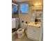 Functional bathroom with a shower, toilet, and vanity with great lighting at 3516 Lake Bayshore Dr # K109, Bradenton, FL 34205