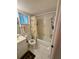 Bright bathroom features a tub, shower, and a window for natural light at 3516 Lake Bayshore Dr # K109, Bradenton, FL 34205