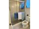 Functional bathroom with a shower, toilet, and neutral-colored tile at 3516 Lake Bayshore Dr # K109, Bradenton, FL 34205