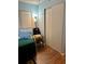 Bedroom with closet and a chair that has a blanket on it at 3516 Lake Bayshore Dr # K109, Bradenton, FL 34205