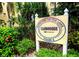 Bayshore on the Lake Phase 2 Clubhouse sign surrounded by lush landscaping at 3516 Lake Bayshore Dr # K109, Bradenton, FL 34205