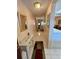 Inviting hallway with tile flooring, leading to various living spaces with lots of natural light at 3516 Lake Bayshore Dr # K109, Bradenton, FL 34205