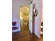 Hallway showing the transition from bedroom to the living room with a view to the sofa at 3516 Lake Bayshore Dr # K109, Bradenton, FL 34205