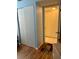Hallway features laminated wood flooring and built-in storage closets at 3516 Lake Bayshore Dr # K109, Bradenton, FL 34205