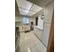 Kitchen featuring white cabinets, countertop space, stainless appliances, and tile floors at 3516 Lake Bayshore Dr # K109, Bradenton, FL 34205