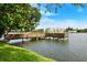 Peaceful lake view from a private wooden dock with building views at 3516 Lake Bayshore Dr # K109, Bradenton, FL 34205