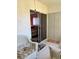 Enclosed lanai providing access to an outside slider and featuring slider door closet access at 3516 Lake Bayshore Dr # K109, Bradenton, FL 34205