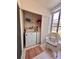 Convenient laundry area with a washer, dryer, shelving, and natural light at 3516 Lake Bayshore Dr # K109, Bradenton, FL 34205