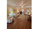 Spacious living room with ceiling fan and a view of the dining area at 3516 Lake Bayshore Dr # K109, Bradenton, FL 34205
