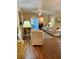 Bright living room with neutral tones, hardwood floors, leading to an outdoor patio space at 3516 Lake Bayshore Dr # K109, Bradenton, FL 34205