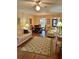 A view of the open-concept living room featuring comfortable seating at 3516 Lake Bayshore Dr # K109, Bradenton, FL 34205