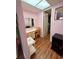 Bedroom featuring a vanity with drawers, chair, mirror and overhead lighting at 3516 Lake Bayshore Dr # K109, Bradenton, FL 34205