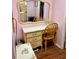 Bedroom featuring a vanity with drawers, chair, mirror and overhead lighting at 3516 Lake Bayshore Dr # K109, Bradenton, FL 34205