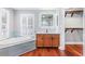 Luxurious bathroom featuring a soaking tub, walk-in closet, wood cabinets, and elegant fixtures at 380 Wellington Ave, Oldsmar, FL 34677
