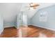 Comfortable bedroom with wood floors, vaulted ceilings, and shuttered windows at 380 Wellington Ave, Oldsmar, FL 34677