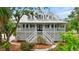 Beautiful house with a charming front porch and detailed landscaping, offering a warm and inviting atmosphere at 380 Wellington Ave, Oldsmar, FL 34677