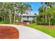 Charming home with a long driveway and welcoming front porch at 380 Wellington Ave, Oldsmar, FL 34677