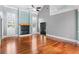 Open-concept living area with a striking fireplace, soaring ceilings, and abundant natural light at 380 Wellington Ave, Oldsmar, FL 34677