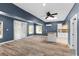 Spacious living room features lots of windows and an adjacent kitchen area at 380 Wellington Ave, Oldsmar, FL 34677