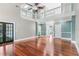 Spacious open-plan living room with hardwood floors, soaring ceilings, and access to multiple rooms at 380 Wellington Ave, Oldsmar, FL 34677
