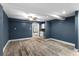 Bright living room featuring tiled flooring, a ceiling fan, and access to the kitchen at 380 Wellington Ave, Oldsmar, FL 34677