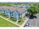 Aerial view of community featuring well-maintained lawns, manicured landscaping, and ample parking at 4002 Carrollwood Palm Ct, Tampa, FL 33624