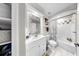 An additional bathroom with shower-tub, modern white vanity, and plenty of storage space at 4002 Carrollwood Palm Ct, Tampa, FL 33624