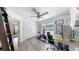 An additional bedroom with a ceiling fan, desk, and large closet for versatility as a home office or guest room at 4002 Carrollwood Palm Ct, Tampa, FL 33624