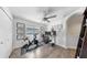 Secondary bedroom that can serve as a bonus or office features neutral tones, a ceiling fan, and large closet at 4002 Carrollwood Palm Ct, Tampa, FL 33624