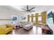 Spacious living room features modern furniture, hardwood floors, and a stylish accent wall at 4002 Carrollwood Palm Ct, Tampa, FL 33624