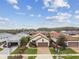 Aerial view of a single Gathering home with a brick driveway and lush landscaping at 4257 Rosatti Rd, Wesley Chapel, FL 33543