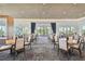 Elegant dining room featuring tables and chairs, perfect for hosting gatherings and enjoying meals at 4257 Rosatti Rd, Wesley Chapel, FL 33543